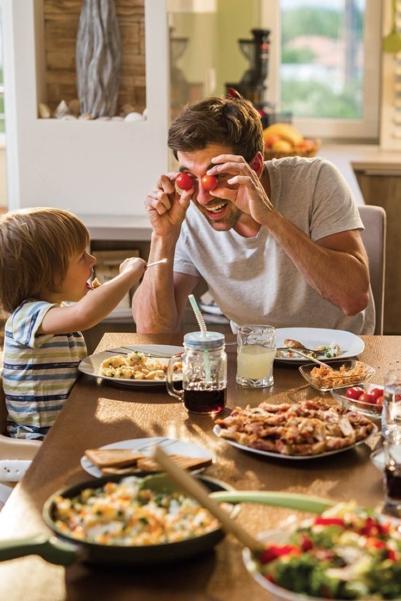 A father and child eating together