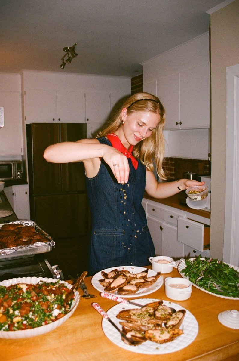 A young woman in a bright kitchen