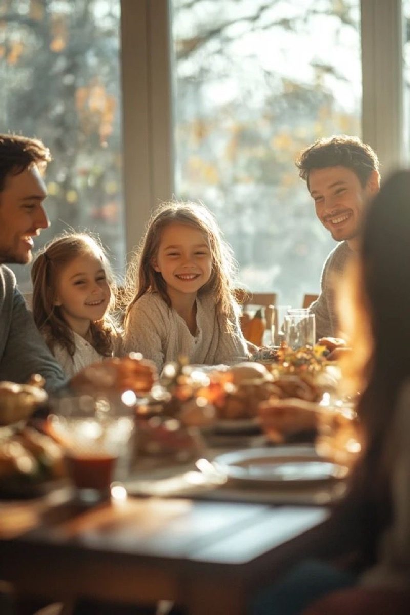 A family around a table in warm autumn light