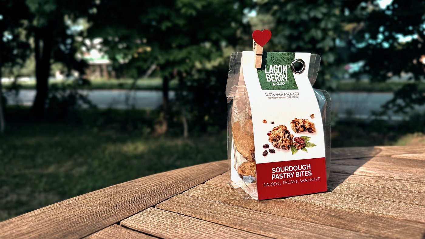 A bag of pastry bites on a garden table in the evening light