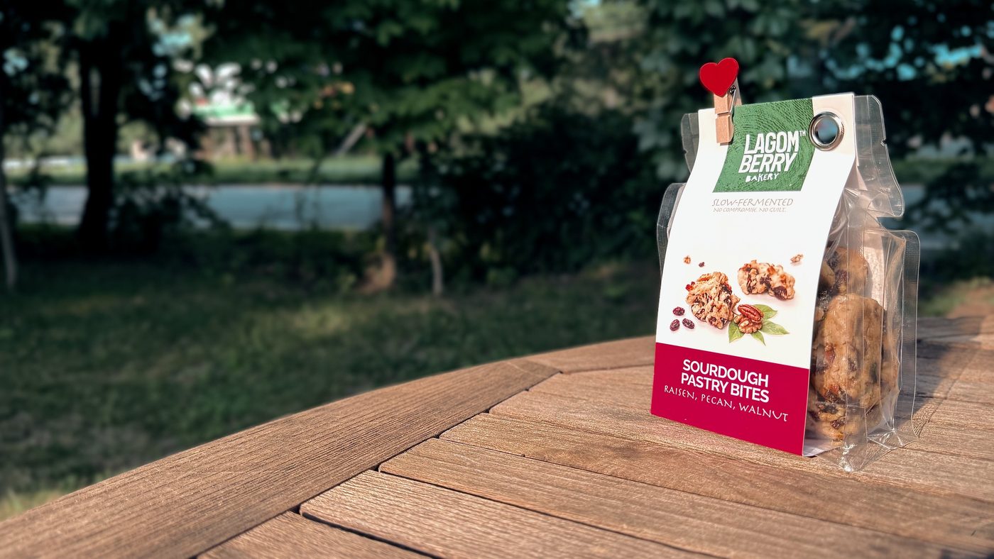 A bag of pastry bites on a garden table, late afternoon